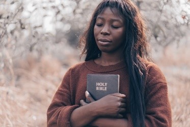 Practical Ways to develop your faith in Christ woman holding bible faith
